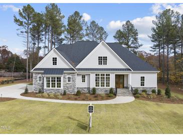 Stunning two-story home with stone accents and a large front yard at 2637 Trifle Ln, Wake Forest, NC 27587