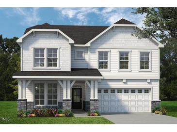 Two-story house with white siding, gray roof, and stone accents at 8740 Maxine St # 7 Selma, Willow Springs, NC 27592