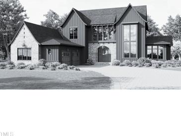 Two-story farmhouse style home with large windows and attached garage at 982 Shelley Rd, Raleigh, NC 27609