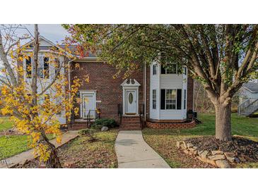 Brick front exterior of charming two-story home with walkway and landscaping at 208 Mallard Creek Dr # B, Graham, NC 27253