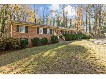 Brick ranch home with a large front yard and mature trees at 161 Pine Cone Dr, Oxford, NC 27565