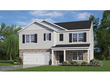 Two-story home with gray siding, brick accents, and a two-car garage at 1136 Middlecrest Dr, Rocky Mount, NC 27804