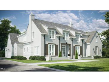 Two-story home with white brick exterior, gray shutters, and a landscaped lawn at 3358 Hampton Rd, Raleigh, NC 27607