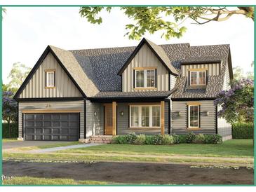 Two-story craftsman style home with gray siding, a dark gray shingle roof, and a two-car garage at 212 Rawhide Dr, Louisburg, NC 27549