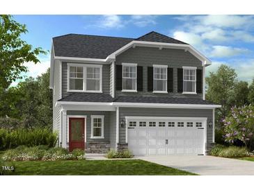 Two-story house with gray siding, white garage door, and red front door at 166 Blue Butterfly Dr, Angier, NC 27501