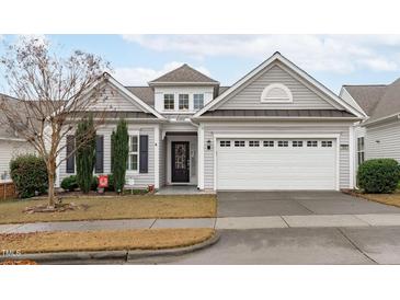 Gray siding two-story house with white garage door and landscaping at 503 Garendon Dr, Cary, NC 27519