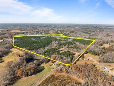 Aerial view of a large land with lush forest and open fields at 2001 Wheelers Church Rd Rd, Hurdle Mills, NC 27541