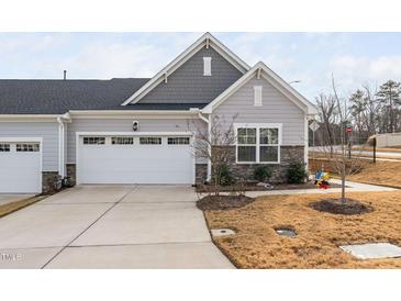 Charming two-story home with attached garage and landscaped front yard at 1021 Shellbank Dr, Durham, NC 27703