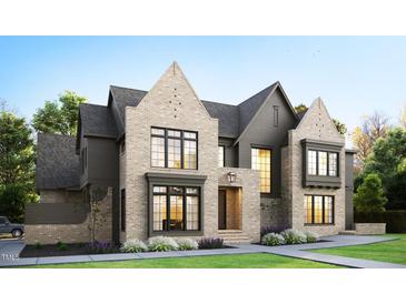Modern two-story home with mixed siding, large windows, and a two-car garage at 5001 Rampart St, Raleigh, NC 27609