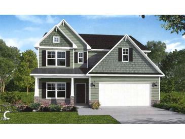 Charming two-story green home with a welcoming front porch and attached garage at 75 Malbec Way, Youngsville, NC 27596
