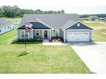 Charming two-story home with a two-car garage and landscaped front yard at 596 Ravensworth Dr, Garner, NC 27529