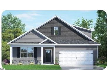 Two-story house with gray siding, white garage door, and landscaping at 7545 Percussion Dr, Apex, NC 27539