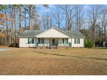 House exterior featuring a front porch and well-maintained lawn at 204 Barbour Rd, Smithfield, NC 27577