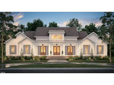 Stunning farmhouse exterior with large windows and a welcoming front porch at 2308 Hardwood Dr, Hillsborough, NC 27278