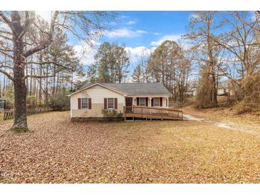 Ranch style home with accessible ramp and mature trees at 105 Mercia Cir, Durham, NC 27703