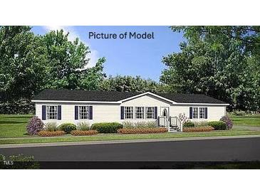 Single-story home with a neutral color palette and landscaping at 6016 Charlies Deadend Rd, Efland, NC 27243