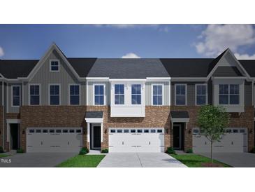 3-story townhome with brick and siding, 2-car garage, and a modern design at 1012 Westerland Way # 201, Durham, NC 27703