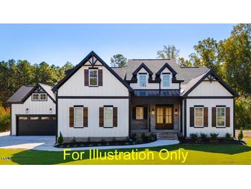 Two-story farmhouse with white siding, black accents, and a charming front porch at 110 Broadleaf Ln, Louisburg, NC 27549