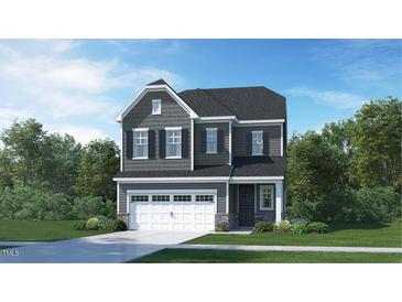 Two-story house with gray siding, white garage door, and landscaping at 605 Emerald Bay Cir, Raleigh, NC 27610