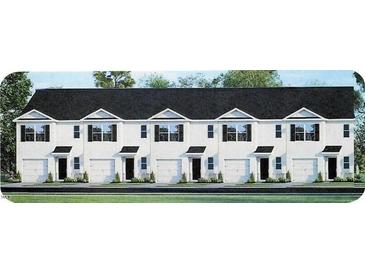 New townhome community with attached garages and well-manicured lawns at 514 Fife Ct, Gibsonville, NC 27249