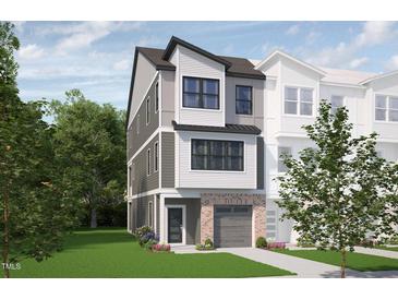 Modern 3-story townhome with gray siding, brick accents, and a 2-car garage at 700 Portia Way, Homesite 17, Morrisville, NC 27560