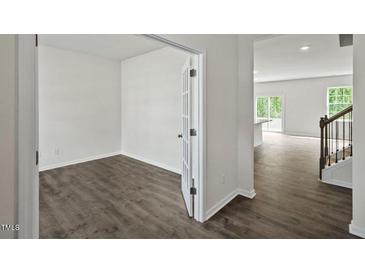 Bright home office features wood-look flooring and french doors at 1230 Middlecrest Dr, Rocky Mount, NC 27804