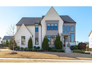 Two-story home with white siding, gray accents, and landscaping at 1816 Center Ridge Dr, Apex, NC 27502