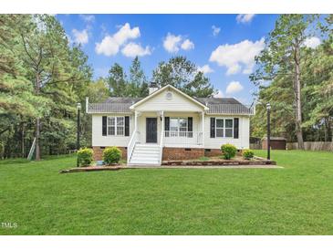 Charming one-story house with a spacious lawn and brick accents at 308 Deep Creek Dr, Clayton, NC 27520