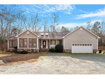 Ranch style home with stone accents, attached garage, and sunroom at 5365 N Nc Highway 49, Burlington, NC 27217