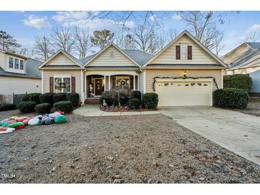 Beautiful ranch home with landscaped yard and attached two-car garage at 934 Lukestone Dr, Fuquay Varina, NC 27526