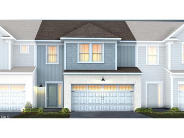 Two-story townhome with gray siding, white trim, and a two-car garage at 283 Broomside Ave, Raleigh, NC 27603