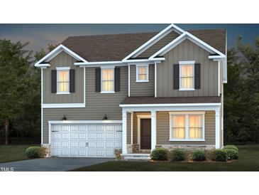 Two-story house with gray siding, white trim, and a two-car garage at 773 Denburn Pl, Raleigh, NC 27603