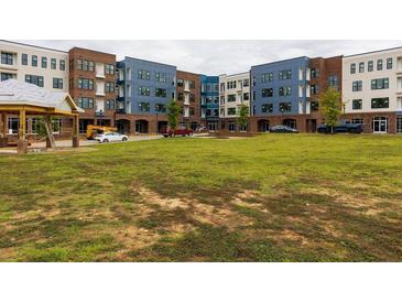 New apartment community with modern brick buildings and landscaped grounds at 2204 Gathering Square Ct, Fuquay Varina, NC 27526