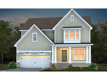 Two story home with gray siding, white trim, and a two-car garage at 47 Rosedale Way, Pittsboro, NC 27312