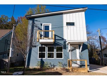 Modern two-story home with blue siding and a balcony at 2407 Hart St # A, Durham, NC 27703