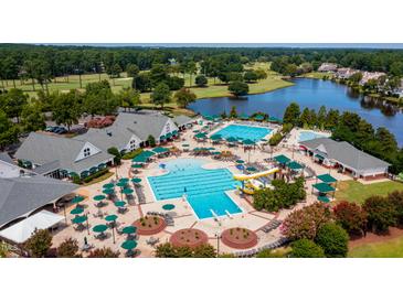 Resort-style pool and clubhouse with expansive lawn areas at 285 Hogans Valley Way, Cary, NC 27513