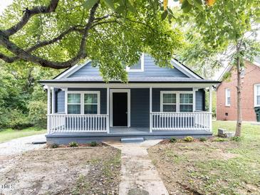 Newly renovated blue house with front porch and walkway at 313 E Mcclanahan St, Oxford, NC 27565