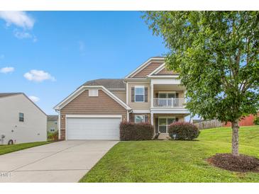 Two-story house with neutral siding, large windows, and a two-car garage at 3832 Stovall Dr, Haw River, NC 27258