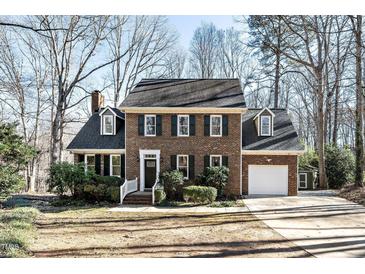 Brick house with attached garage and landscaping at 4601 Eastbrae Ct, Fuquay Varina, NC 27526