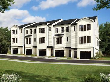 Row of modern townhouses with attached garages at 3702 Nova Star Ln, Raleigh, NC 27612