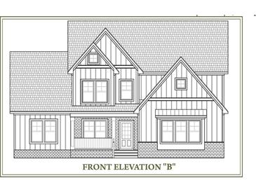 Front elevation of two story farmhouse style home at 5404 Garrett Rd, Durham, NC 27707