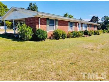 Ranch style brick home with carport and large yard at 2164 Ray Rd, Spring Lake, NC 28390