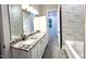 Bathroom with granite double vanity and marble tile at 1350 Geneva Albright Rd, Graham, NC 27253