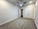 Spacious bedroom with ceiling fan and double doors at 1350 Geneva Albright Rd, Graham, NC 27253
