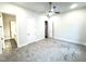 Spacious bedroom with neutral carpeting and ceiling fan at 1350 Geneva Albright Rd, Graham, NC 27253