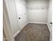 Walk-in closet with wire shelving and carpeting at 1350 Geneva Albright Rd, Graham, NC 27253