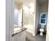 Bathroom with soaking tub, toilet and granite countertop at 1350 Geneva Albright Rd, Graham, NC 27253