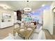 Open concept dining room features a wood table and white chairs at 1350 Geneva Albright Rd, Graham, NC 27253