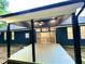 Covered back porch with ceiling fan and access to the home's interior at 1350 Geneva Albright Rd, Graham, NC 27253