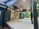 Covered back porch with ceiling fan and access to the home's interior at 1350 Geneva Albright Rd, Graham, NC 27253
